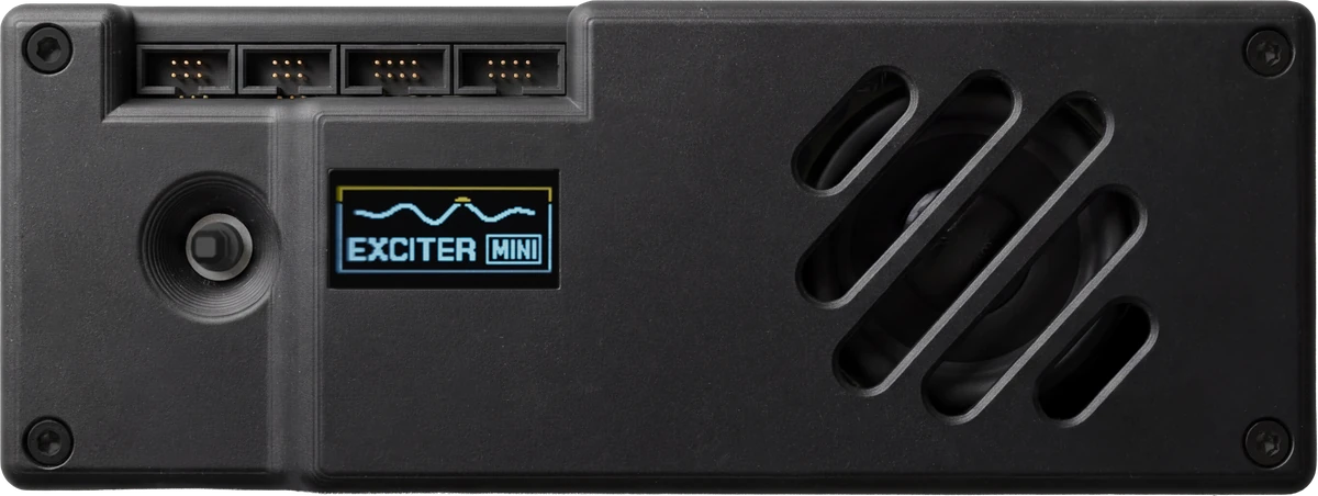 Exciter Mini — front view with OLED status display, speaker grille and four accessory ports