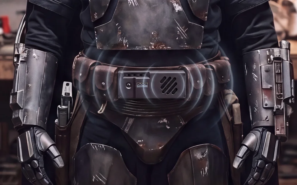 Exciter Mini mounted on a cosplay utility belt, sound waves radiating from the speaker